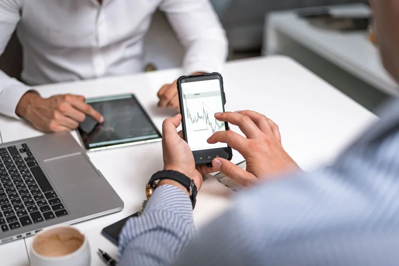 Person shopping using a mobile phone showing mobile ecommerce conversion behavior